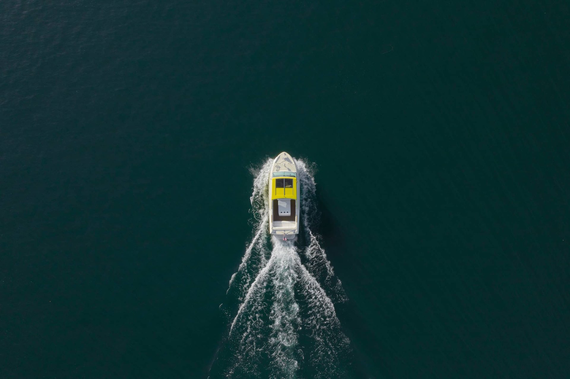 Boat speeding across deep blue water